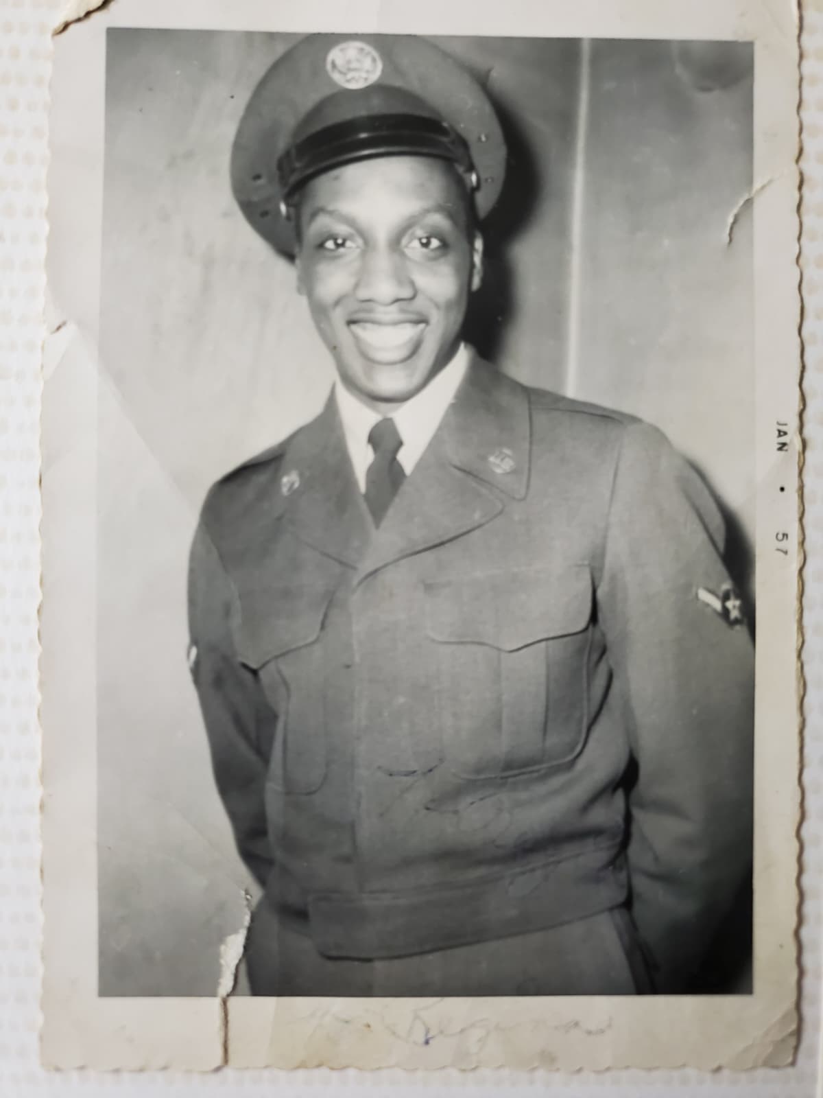Airman Ronald English smiling in his United States Air Force dress uniform, January 1957